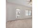 Bright bedroom featuring neutral carpet, a ceiling fan, and access to an outdoor patio or balcony at 3150 E Beardsley Rd # 1091, Phoenix, AZ 85050