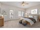 Cozy bedroom with a queen-size bed and private outdoor access to a balcony or patio at 3150 E Beardsley Rd # 1091, Phoenix, AZ 85050