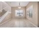 Open dining room includes tile floors, staircase, and bright windows offering natural light at 3150 E Beardsley Rd # 1091, Phoenix, AZ 85050