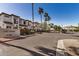 View of Los Paseos Townhomes entry with mature landscaping and a gated entrance at 3150 E Beardsley Rd # 1091, Phoenix, AZ 85050