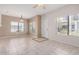 Bright living room boasts tile flooring, neutral paint, and plenty of natural light from large windows at 3150 E Beardsley Rd # 1091, Phoenix, AZ 85050