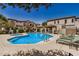 Community pool area with lounge chairs and shaded seating, perfect for relaxation at 3150 E Beardsley Rd # 1091, Phoenix, AZ 85050