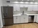 This is a beautiful kitchen with stainless steel appliances, white countertops, and plenty of storage space at 3517 E Blanche Dr, Phoenix, AZ 85032