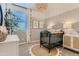 Charming Bedroom featuring a decorative chandelier, whimsical wall decor, and a crib with stylish bedding at 36545 W Maddaloni Ave, Maricopa, AZ 85138