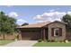 Charming single-story home featuring a stone facade and a well-maintained front yard at 36545 W Maddaloni Ave, Maricopa, AZ 85138