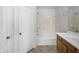 Bright bathroom featuring a shower-tub combo and single sink vanity, perfect for everyday use at 40168 W Sanders Way, Maricopa, AZ 85138