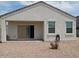 Back patio and gravel landscaping offer a blank canvas for your backyard dreams at 4032 N 308Th Dr, Buckeye, AZ 85396