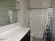 Bright bathroom featuring tile floors, shower/tub combo and updated fixtures at 4032 N 308Th Dr, Buckeye, AZ 85396