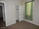 Carpeted bedroom featuring a window and closet at 4032 N 308Th Dr, Buckeye, AZ 85396
