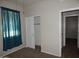 Cozy bedroom featuring carpet, a window and access to a closet at 4032 N 308Th Dr, Buckeye, AZ 85396