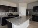 Modern kitchen with granite counters, stainless steel appliances and ample cabinet space at 4032 N 308Th Dr, Buckeye, AZ 85396