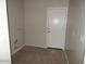 Large laundry room with tile flooring at 4032 N 308Th Dr, Buckeye, AZ 85396