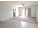 Spacious living room featuring tile and carpet floors and patio access at 4032 N 308Th Dr, Buckeye, AZ 85396