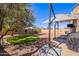 This backyard has a covered patio, an outdoor kitchen and ample space for outdoor activities and entertaining at 42406 W Posada Dr, Maricopa, AZ 85138