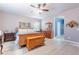 Cozy bedroom with wood furniture, light-colored walls, and an inviting atmosphere for a restful night at 42406 W Posada Dr, Maricopa, AZ 85138