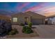 Charming single-story home featuring desert landscaping and an attached two-car garage at 42406 W Posada Dr, Maricopa, AZ 85138