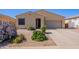 Inviting single-story home featuring a desert-landscaped front yard and a two-car garage at 42406 W Posada Dr, Maricopa, AZ 85138