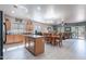 Bright kitchen with island, stainless steel appliances, and an open floor plan at 42406 W Posada Dr, Maricopa, AZ 85138