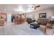 Bright, open living space with kitchen, dining, and seating areas, perfect for modern living at 42406 W Posada Dr, Maricopa, AZ 85138