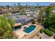 Aerial view of a single-Gathering home showcasing the pool, covered patio, and solar panels at 511 E Port Au Prince Ln, Phoenix, AZ 85022