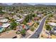 Neighborhood view featuring mature trees, lush lawns, and diverse architectural styles in a serene suburban setting at 511 E Port Au Prince Ln, Phoenix, AZ 85022