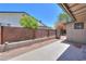Enclosed back patio with lattice fence and yard area at 511 E Port Au Prince Ln, Phoenix, AZ 85022