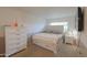 Bright bedroom with a white bed frame, ample drawer space and a large window at 511 E Port Au Prince Ln, Phoenix, AZ 85022