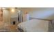 A view of a bedroom with light walls, white trim, and a doorway to another room at 511 E Port Au Prince Ln, Phoenix, AZ 85022