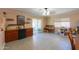Brightly lit dining area with sliding glass doors leading to an outdoor patio and well stocked mini bar at 511 E Port Au Prince Ln, Phoenix, AZ 85022