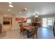 Dining area with an open concept, comfortable seating, and access to the backyard at 511 E Port Au Prince Ln, Phoenix, AZ 85022