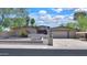 Charming single-story home featuring a large driveway, desert landscaping, and an American flag proudly displayed at 511 E Port Au Prince Ln, Phoenix, AZ 85022
