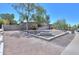 Charming single-story home featuring a large driveway, desert landscaping, and an American flag proudly displayed at 511 E Port Au Prince Ln, Phoenix, AZ 85022