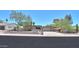 Charming single-story home featuring a large driveway, desert landscaping, and an American flag proudly displayed at 511 E Port Au Prince Ln, Phoenix, AZ 85022