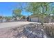 Charming single-story home featuring a large driveway, desert landscaping, and an American flag proudly displayed at 511 E Port Au Prince Ln, Phoenix, AZ 85022