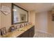 Hallway with a large mirror over built-in cabinets for Gathering photos at 511 E Port Au Prince Ln, Phoenix, AZ 85022