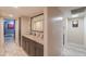 Hallway with built-in cabinets, decor and view of the dog bed in the far room at 511 E Port Au Prince Ln, Phoenix, AZ 85022