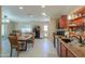 Well-lit kitchen with stainless appliances, a dining area, and a view to the backyard at 511 E Port Au Prince Ln, Phoenix, AZ 85022