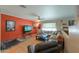 Inviting living room featuring comfortable seating, a ceiling fan, and a television at 511 E Port Au Prince Ln, Phoenix, AZ 85022