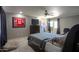 Comfortable main bedroom features a ceiling fan, and decorative wall art at 511 E Port Au Prince Ln, Phoenix, AZ 85022