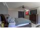 Comfortable bedroom with a ceiling fan, and a flat screen television at 511 E Port Au Prince Ln, Phoenix, AZ 85022