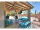 Inviting covered patio with comfortable seating and views of the pool area at 511 E Port Au Prince Ln, Phoenix, AZ 85022