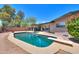 Large backyard pool area featuring mature trees and diving board at 511 E Port Au Prince Ln, Phoenix, AZ 85022