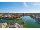 Expansive aerial view of waterfront homes and a serene lake community under a clear sky at 5281 W Quail Ave, Glendale, AZ 85308