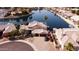 Expansive waterfront property featuring a well-maintained home with tile roof and attached two-car garage at 5281 W Quail Ave, Glendale, AZ 85308