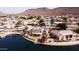 Lovely waterfront community with beautiful landscaping and a home with solar panels and a private dock at 5281 W Quail Ave, Glendale, AZ 85308
