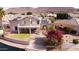 This stunning backyard features vibrant landscaping, including flowers and stairs to a private boat dock at 5281 W Quail Ave, Glendale, AZ 85308