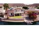 Beautiful waterfront backyard featuring a putting green, outdoor grill, and solar panels at 5281 W Quail Ave, Glendale, AZ 85308