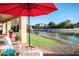 Outdoor patio with putting green and waterfront views are perfect for entertaining and enjoying the outdoors at 5281 W Quail Ave, Glendale, AZ 85308