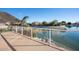 Outdoor balcony with a view of the lake, palm trees, and nearby houses at 5281 W Quail Ave, Glendale, AZ 85308