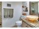 Charming bathroom with granite countertops and decorative bowl sink at 5281 W Quail Ave, Glendale, AZ 85308